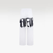 The Contrast Manifesto Kaki Pants | Bold Graffiti Wide-Leg Streetstyle Statement